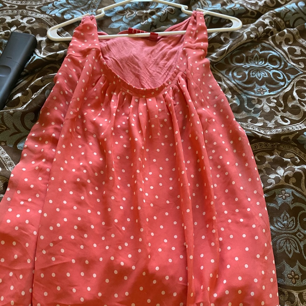 Orange sleeveless polka dot shirt